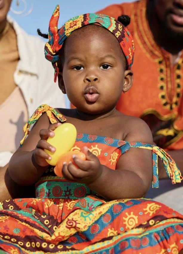 Child in vibrant traditional African clothing